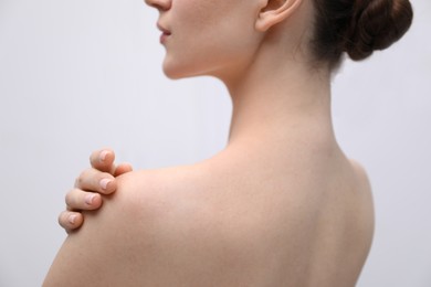 Photo of Beautiful woman on light background, back view