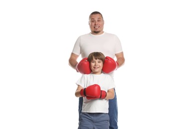 Photo of Father and his son in boxing gloves on white background