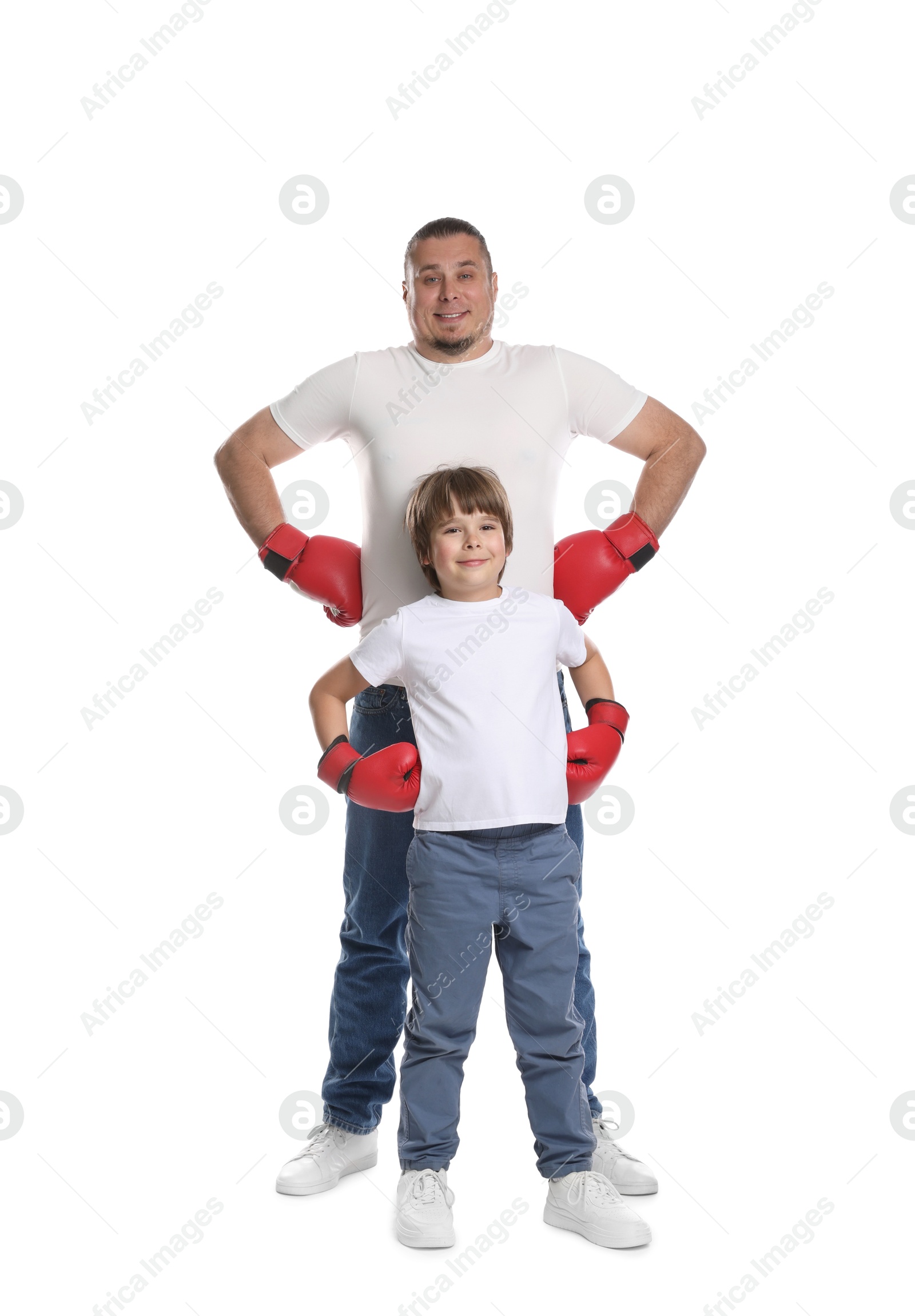 Father and his son in boxing gloves on white background Photo of Father and his son in boxing gloves on white background
