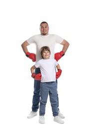 Photo of Father and his son in boxing gloves on white background