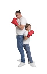 Photo of Father and his son in boxing gloves on white background