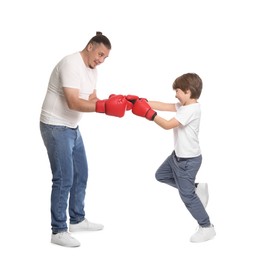Photo of Father and his son boxing on white background