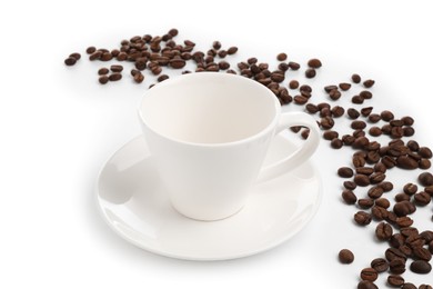 Photo of Ceramic cup with roasted coffee beans isolated on white
