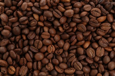 Photo of Roasted coffee beans as background, closeup view