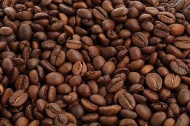 Photo of Roasted coffee beans as background, closeup view