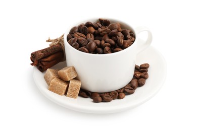 Photo of Ceramic cup with roasted coffee beans, sugar and cinnamon isolated on white