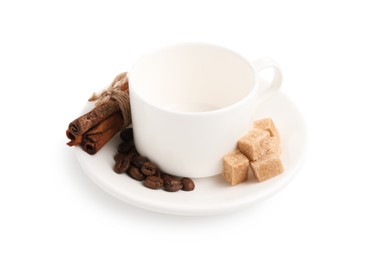 Photo of Ceramic cup with roasted coffee beans, sugar and cinnamon isolated on white