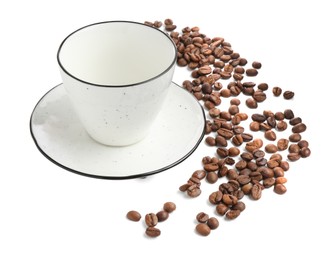 Photo of Ceramic cup with roasted coffee beans isolated on white
