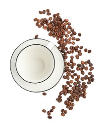 Photo of Ceramic cup with roasted coffee beans isolated on white, top view
