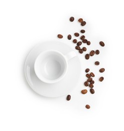 Photo of Ceramic cup with roasted coffee beans isolated on white, top view