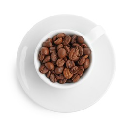 Photo of Ceramic cup with roasted coffee beans isolated on white, top view