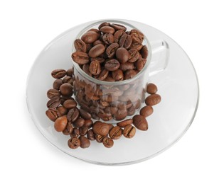 Photo of Glass cup with roasted coffee beans isolated on white