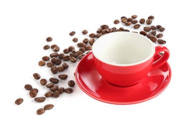 Photo of Ceramic cup with roasted coffee beans isolated on white