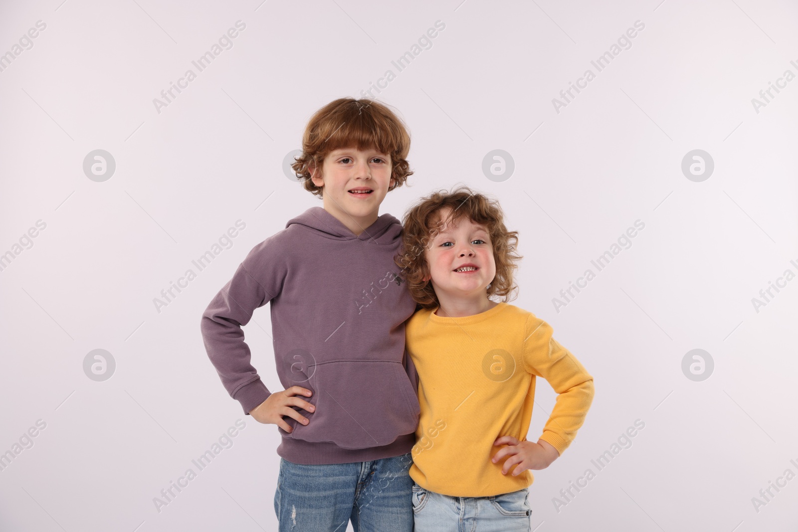 Cute little brothers hugging on white background Photo of Cute little brothers hugging on white background