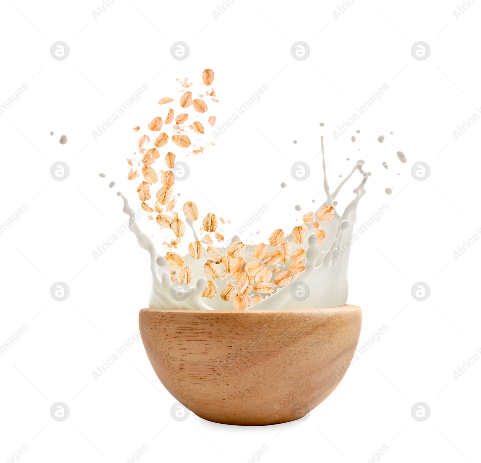 Oats and milk splashing out from bowl on white background Image of Oats and milk splashing out from bowl on white background