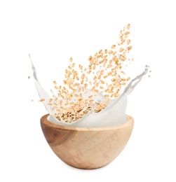 Image of Oats and milk splashing out from bowl on white background