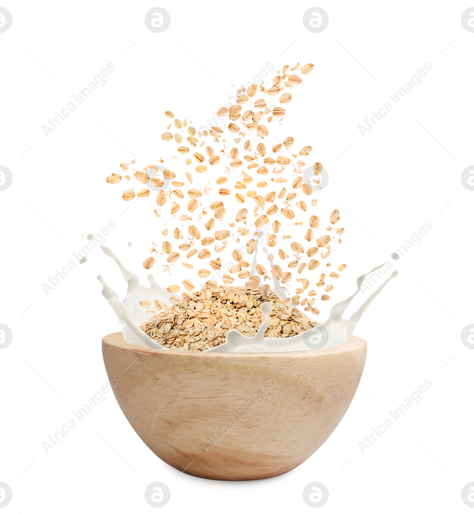 Oats and milk splashing out from bowl on white background Image of Oats and milk splashing out from bowl on white background