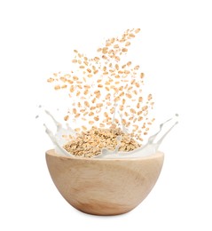 Image of Oats and milk splashing out from bowl on white background