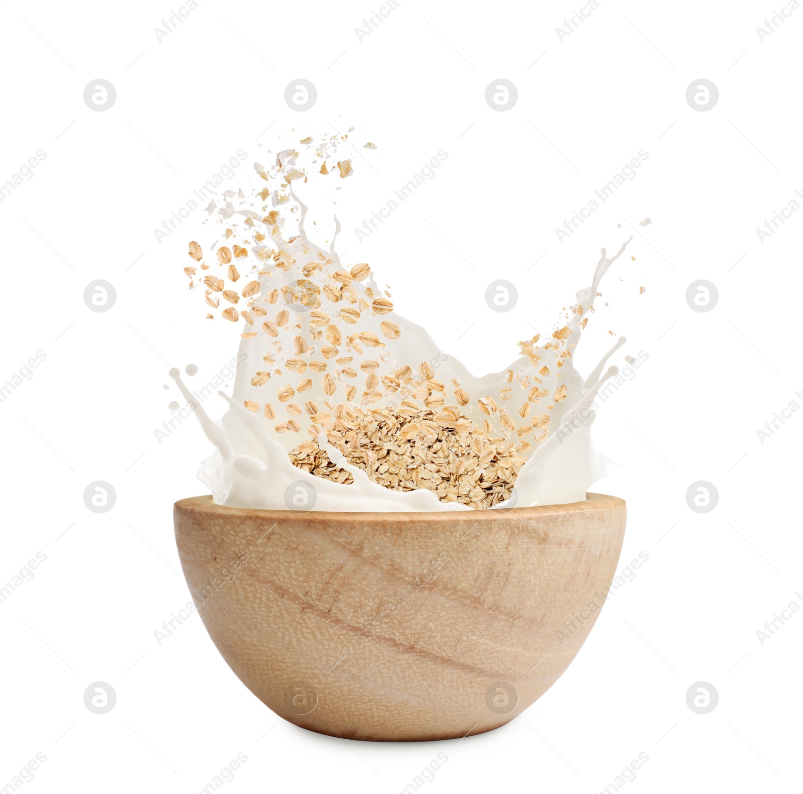 Oats and milk splashing out from bowl on white background Image of Oats and milk splashing out from bowl on white background