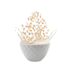 Image of Oats and milk splashing out from bowl on white background