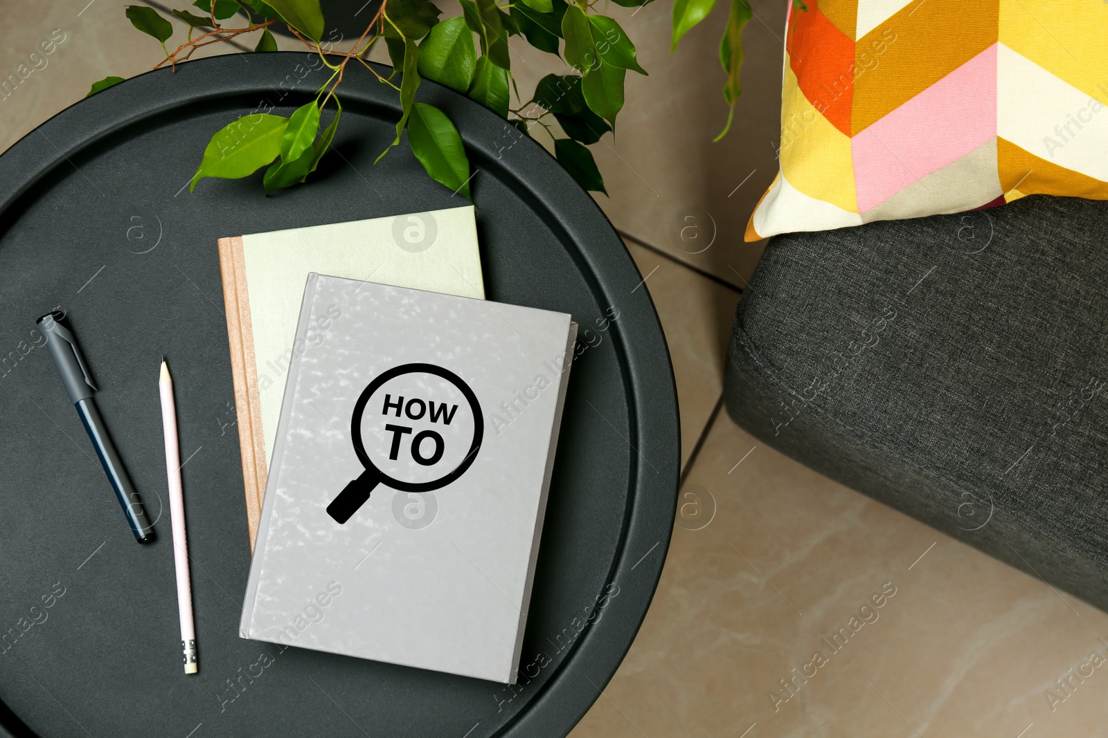 How To book, pencil and pen on table indoors, top view. User guide Image of How To book, pencil and pen on table indoors, top view. User guide