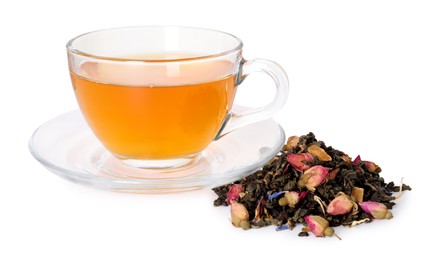 Photo of Delicious herbal tea in glass cup and dry leaves isolated on white