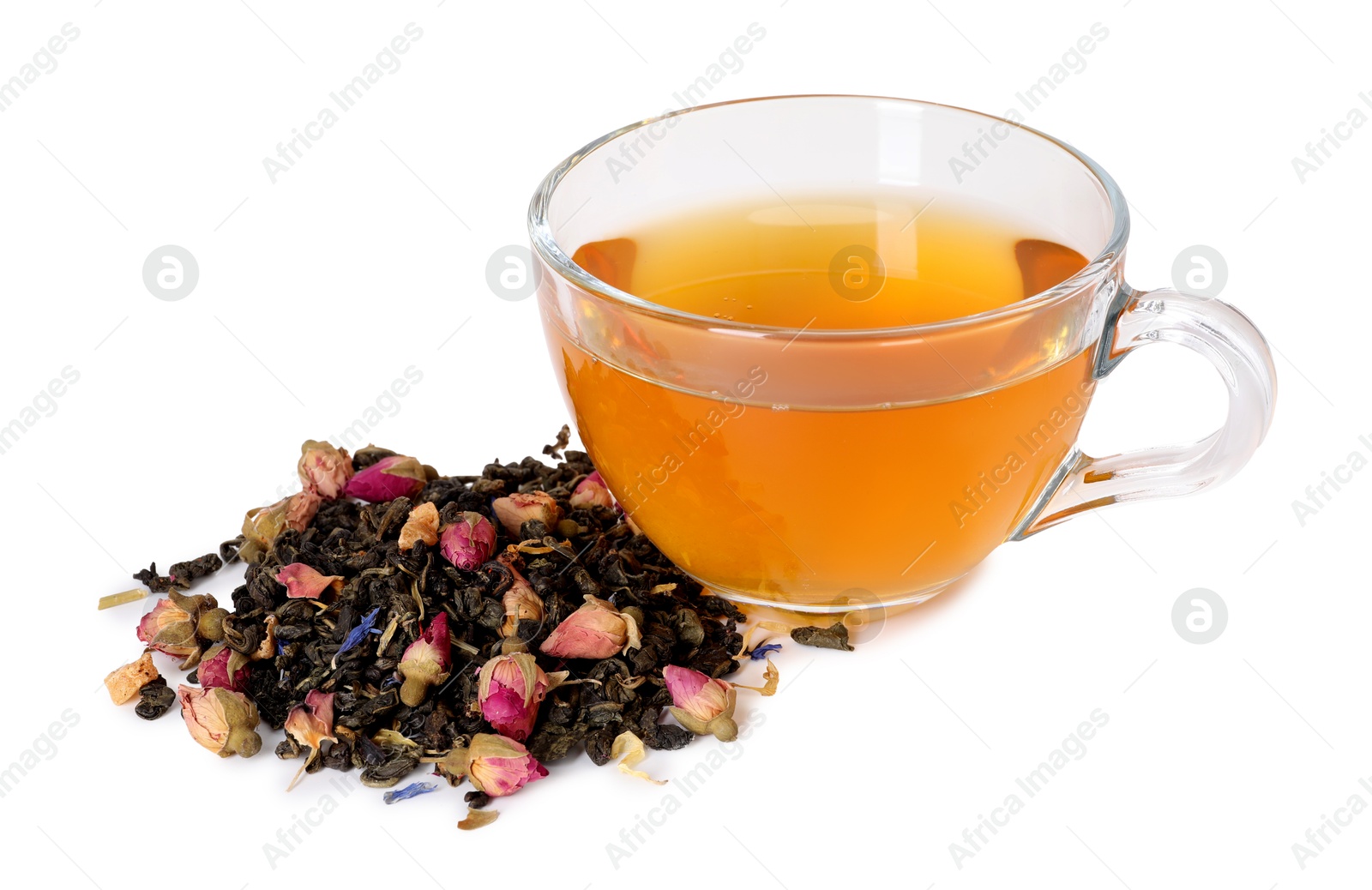 Delicious herbal tea in glass cup and dry leaves isolated on white Photo of Delicious herbal tea in glass cup and dry leaves isolated on white