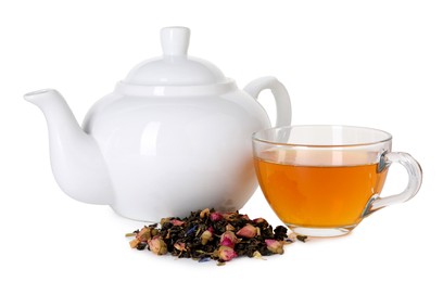 Photo of Delicious herbal tea in glass cup, teapot and dry leaves isolated on white
