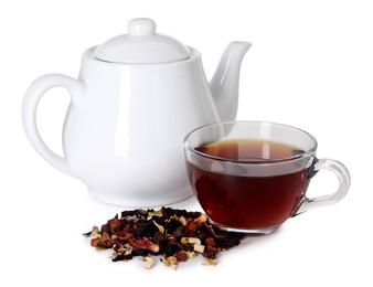 Photo of Delicious herbal tea in glass cup, teapot and dry leaves isolated on white