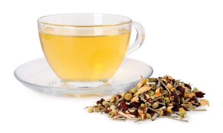 Photo of Delicious herbal tea in glass cup and dry leaves isolated on white