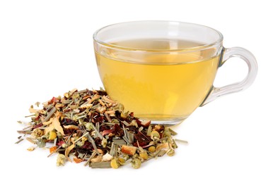Photo of Delicious herbal tea in glass cup and dry leaves isolated on white