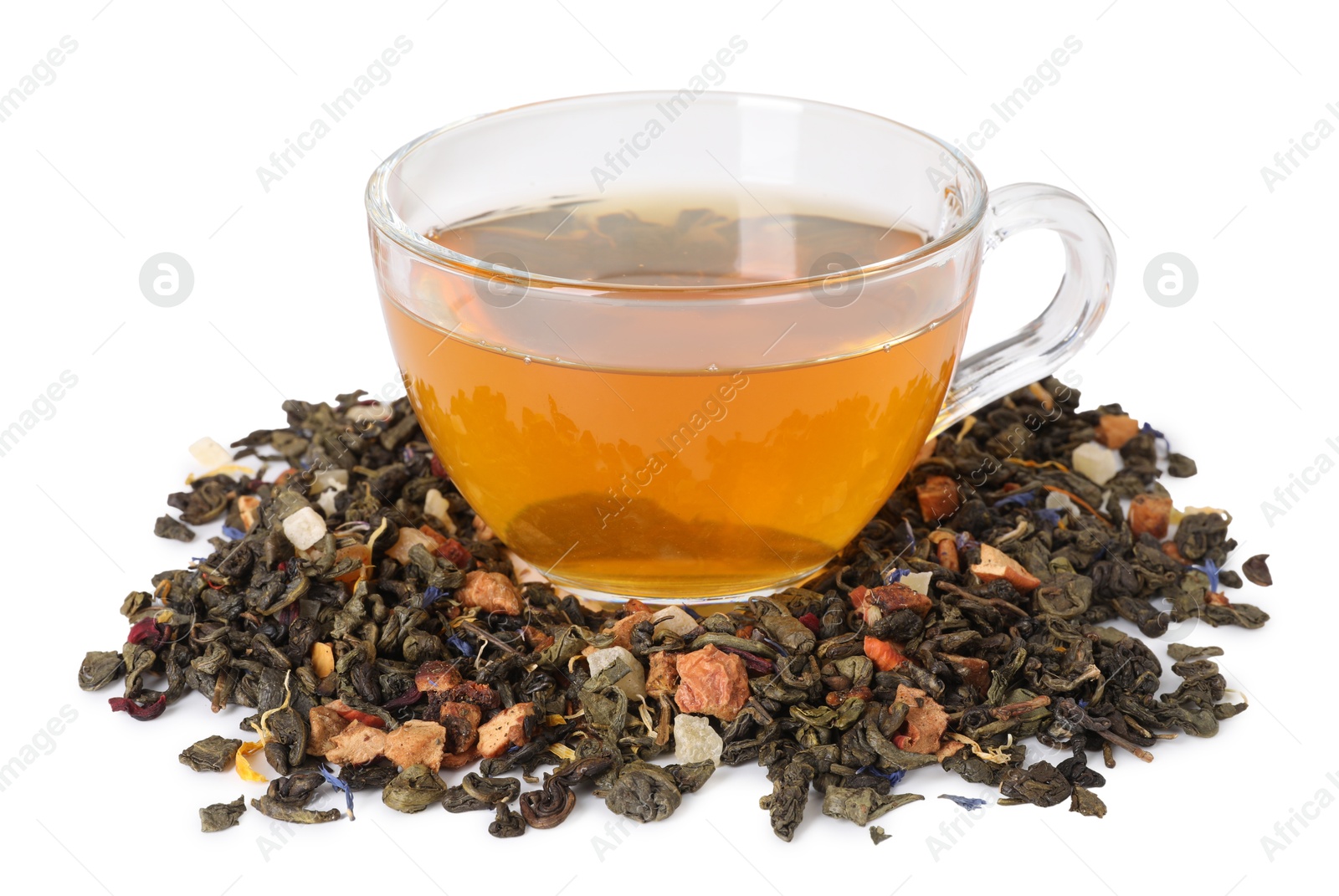 Delicious herbal tea in glass cup and dry leaves isolated on white Photo of Delicious herbal tea in glass cup and dry leaves isolated on white