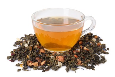 Photo of Delicious herbal tea in glass cup and dry leaves isolated on white