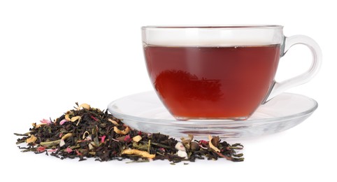 Photo of Delicious herbal tea in glass cup and dry leaves isolated on white