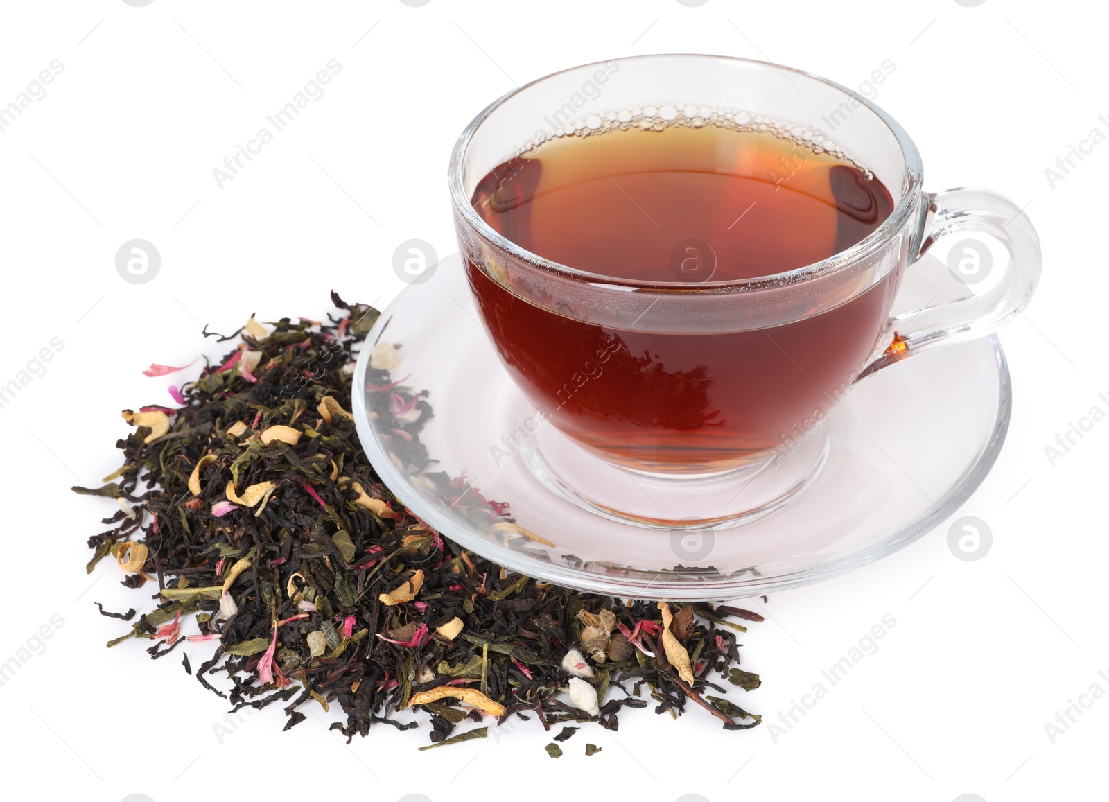 Delicious herbal tea in glass cup and dry leaves isolated on white Photo of Delicious herbal tea in glass cup and dry leaves isolated on white
