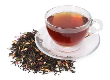 Photo of Delicious herbal tea in glass cup and dry leaves isolated on white