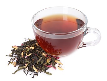 Photo of Delicious herbal tea in glass cup and dry leaves isolated on white