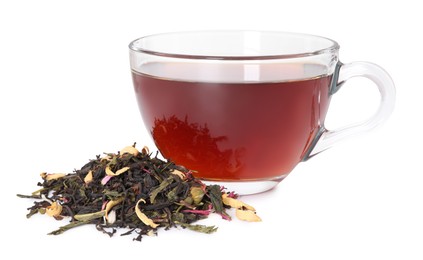 Photo of Delicious herbal tea in glass cup and dry leaves isolated on white