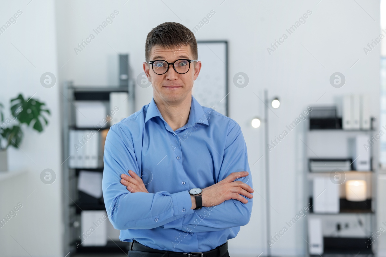 Photo of Portrait of surprised middle aged man in office
