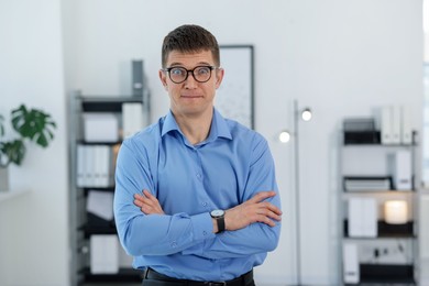 Photo of Portrait of surprised middle aged man in office