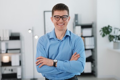 Photo of Portrait of handsome middle aged man in office