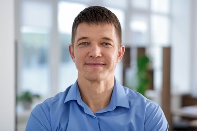 Photo of Portrait of handsome middle aged man indoors