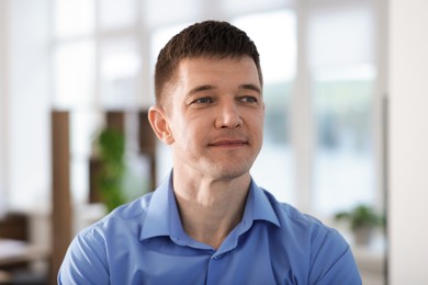 Photo of Portrait of handsome middle aged man indoors
