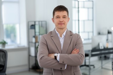 Photo of Portrait of handsome middle aged man in office