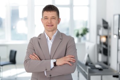 Photo of Portrait of handsome middle aged man in office