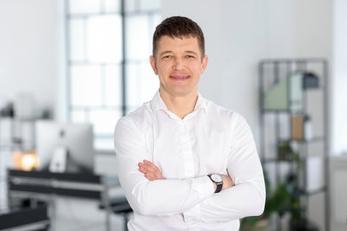 Photo of Portrait of handsome middle aged man in office