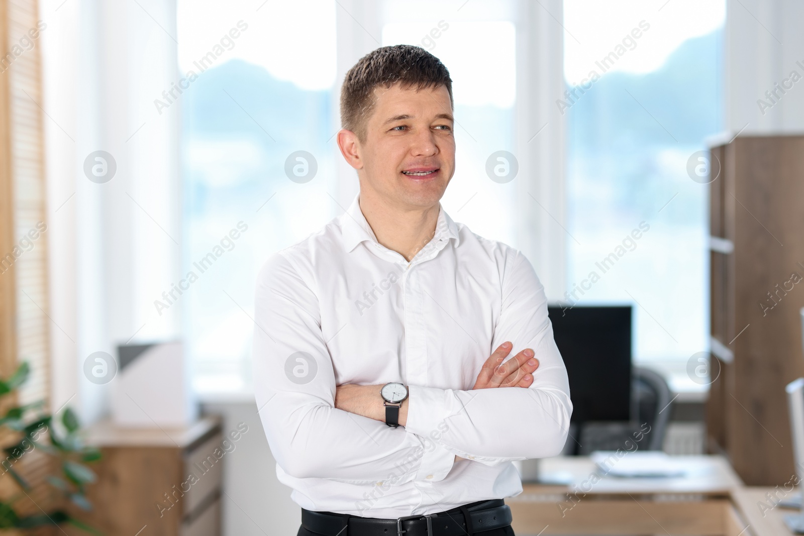 Portrait of handsome middle aged man in office Photo of Portrait of handsome middle aged man in office