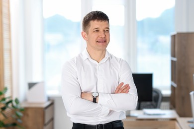 Photo of Portrait of handsome middle aged man in office