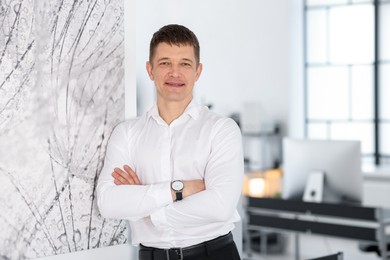 Photo of Portrait of handsome middle aged man indoors. Space for text