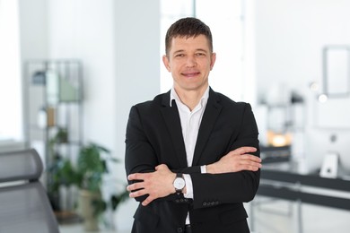 Photo of Portrait of handsome middle aged man indoors